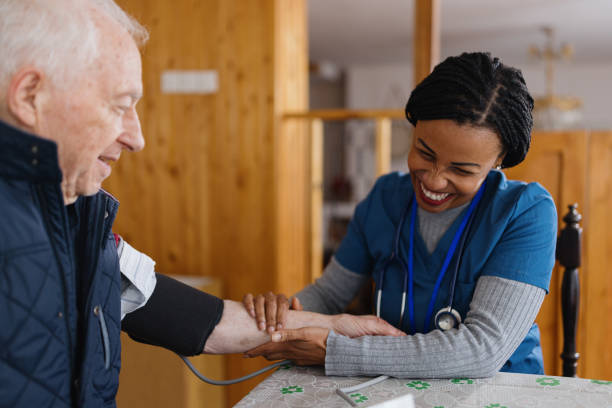 Nurse measures blood pressure to senior man