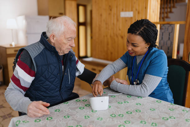 istock Nurse measures blood pressure to senior man 1445018003