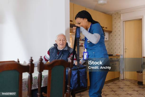 Healthcare Worker Arriving At Patients House Stock Photo - Download Image Now - Discussion, Nurse, 35-39 Years
