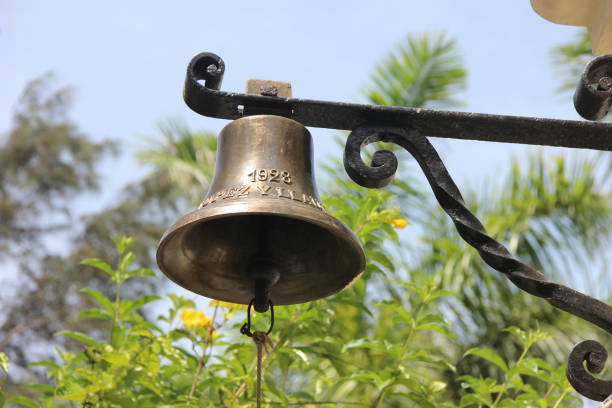 Metallic bell in the Ernest Hemingway House Finca Vigia, Cuba, July 2016. Metallic bell in the Ernest Hemingway House hemingway house stock pictures, royalty-free photos & images