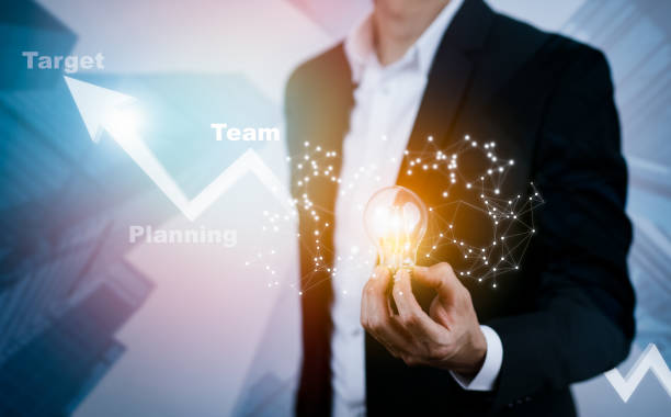 istock Businessman holding light bulbs, ideas of new ideas with innovative technology and creativity, concept creativity with bulbs that shine glitter, businessman holding illuminated light bulb, innovation 1445018283