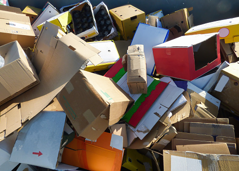 Used cardboard boxes at a collection center for recycling. Circular Economy