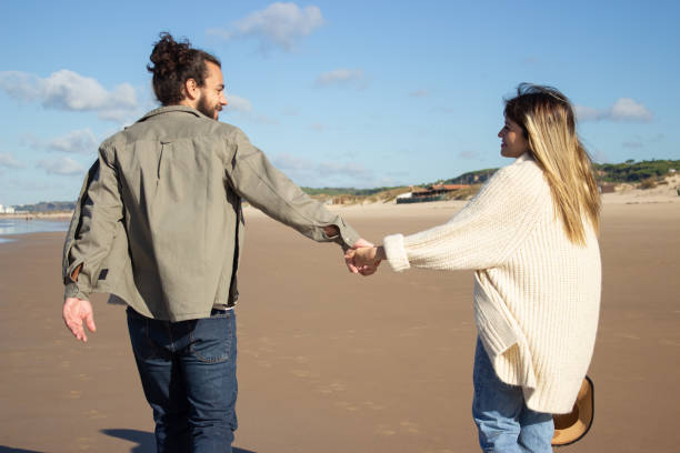 istock Back view of Caucasian couple on summer vacation 1445019529