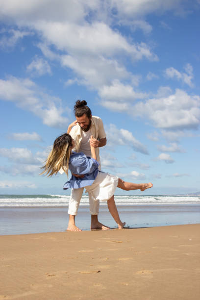 istock Loving Caucasian couple dancing at the beach 1445020203