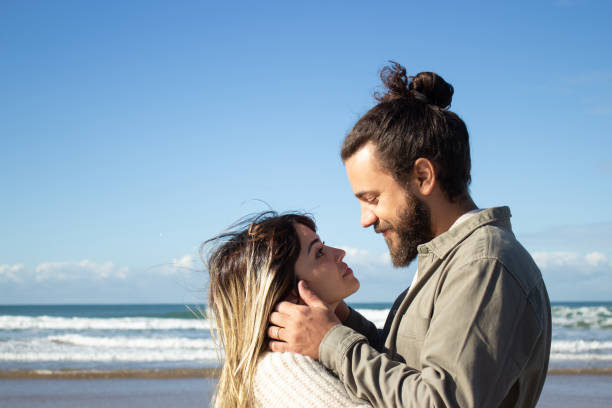 istock Happy romantic couple spending time at seashore 1445020227