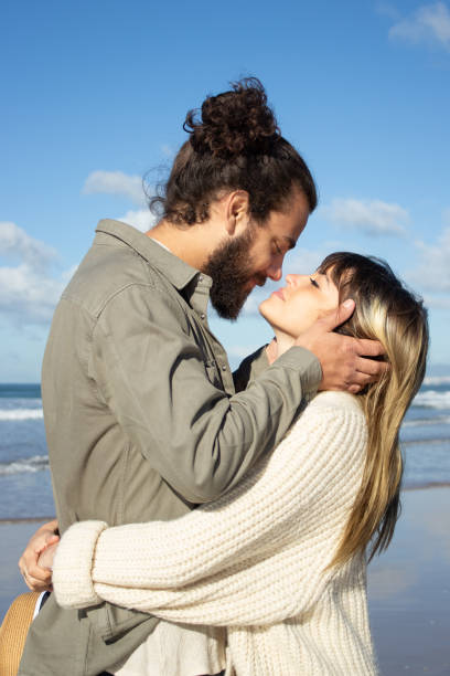 istock Romantic couple spending time at seashore 1445020244