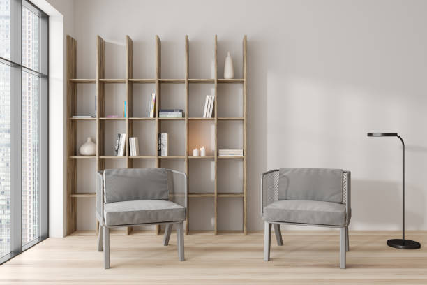 istock Light meeting room interior with seats and shelf and books, panoramic window 1445022533