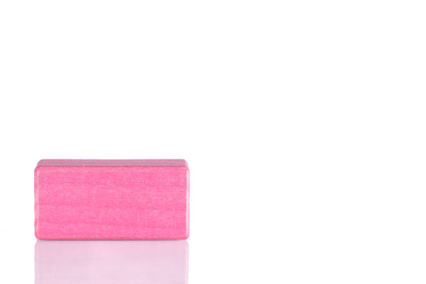 istock Wooden cube of pink color on a white background 1445023601