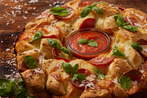 Pepperoni Pizza Pull Apart Monkey Bread with Marinara Dipping Sauce. Made with Biscuit Dough