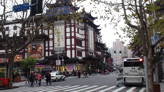 Shanghai Old Town Market In East China, China East Asia, Traditional Chinese Architecture, Police Vehicle, Road Traffic, Retail Store, People Walking, Looking For Items Buy Scene