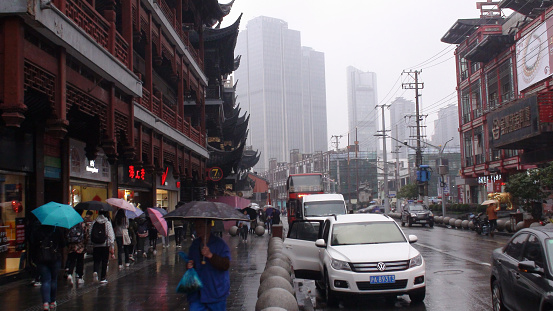 Shanghai Old Town Market In East China, China East Asia, Traditional Chinese Architecture, Road Traffic, Retail Store, People Walking, Looking For Items Buy, Shopping, Holding Umbrella While Is Raining Scene