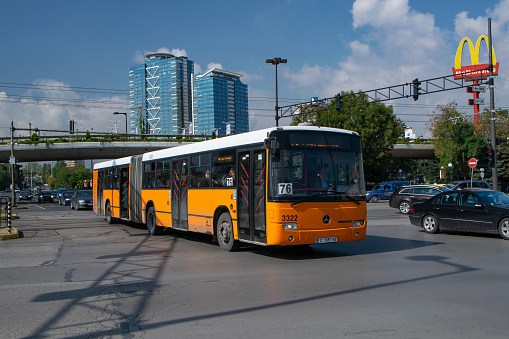 Sofia, Bulgaria - 26 September, 2019: Diesel articulated bus Mercedes-Benz Conecto on a street. This bus is popular vehicle in Eastern Europe.