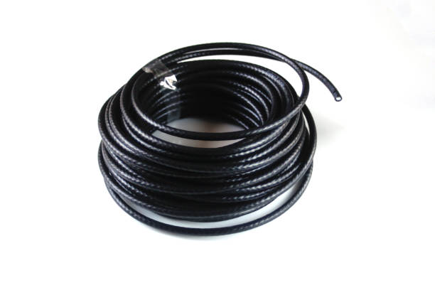 istock Defocus black rolled electric cable isolated on white. Electrical cable, energy and technology equipment isolated on white background. Out of focus 1445025630