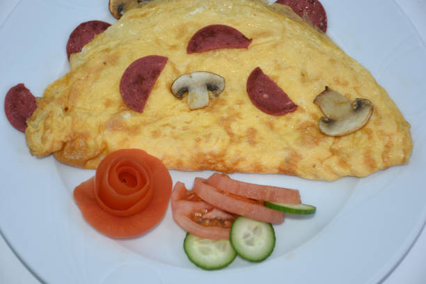 istock omelette with sausage served with cucumber and tomato on plate isolated 1445027521