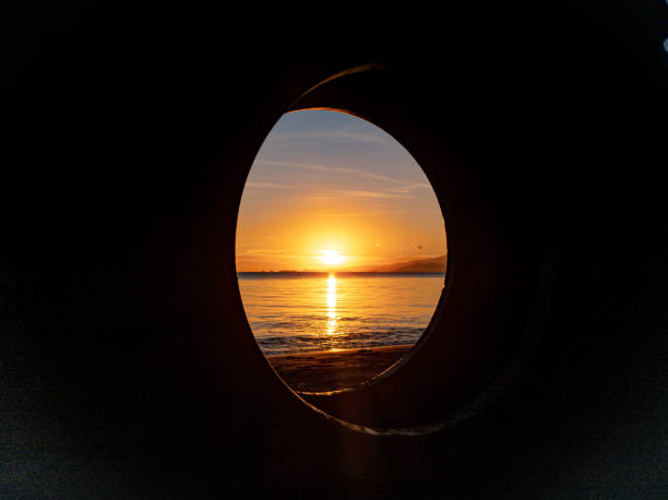 istock silhouette of objects on the beach with sunrise 1445031347