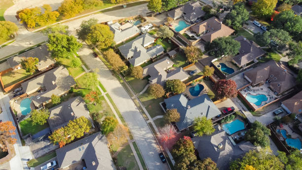 Upscale single family home with swimming pool and colorful fall foliage near Dallas, Texas, America stock photo