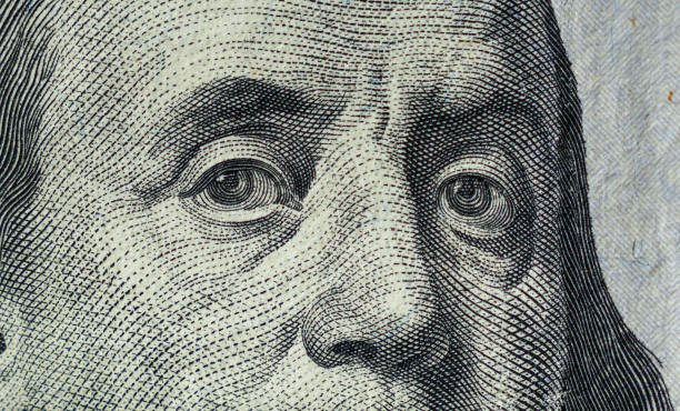 istock Closeup of Benjamin Franklin on 100 dollar bill 1445033368