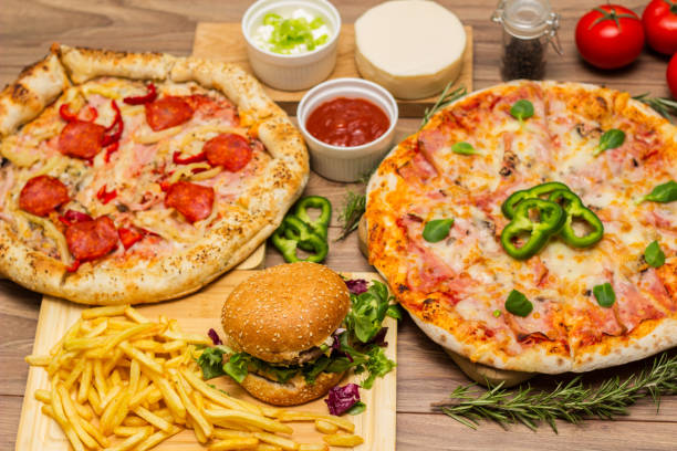 istock Pizza and hamburger on wooden background 1445035455