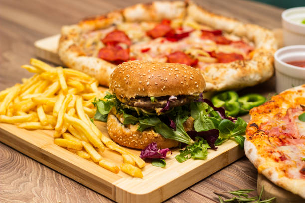 istock Pizza and hamburger on wooden background 1445035466