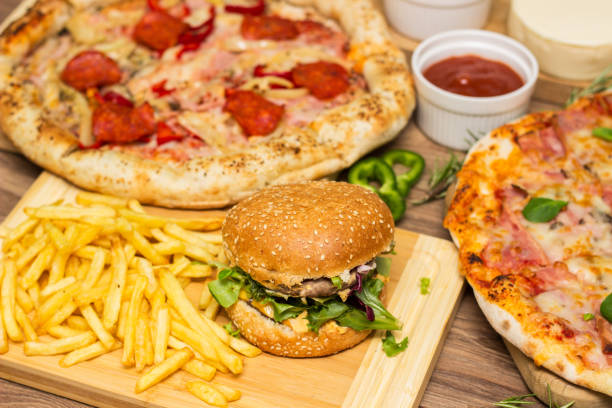 istock Pizza and hamburger on wooden background 1445035487