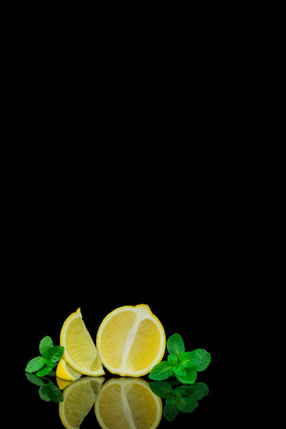 istock Still life, lemon and lime on black background 1445036833