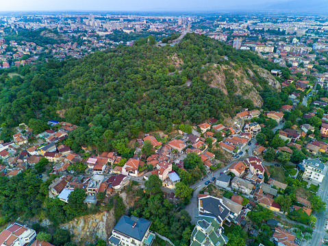 Old historical town of Plovdiv with residential buildings and churches in Bulgaria in valley of Rhodope mountains and forests