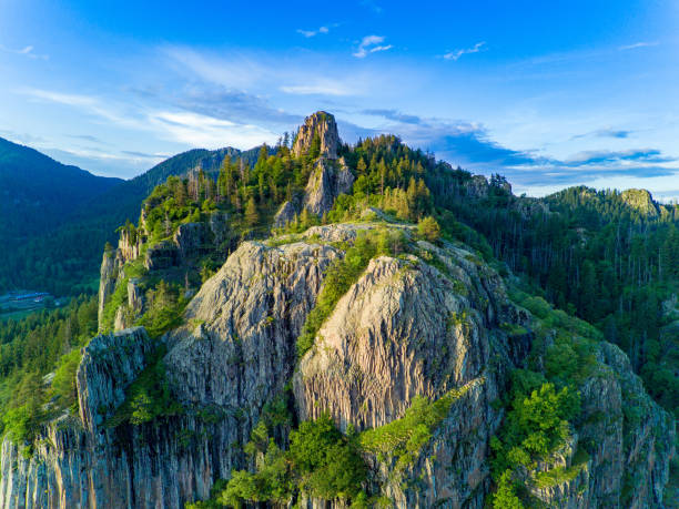 Peak of Rhodope mountain with forests against background of clouds stock photo