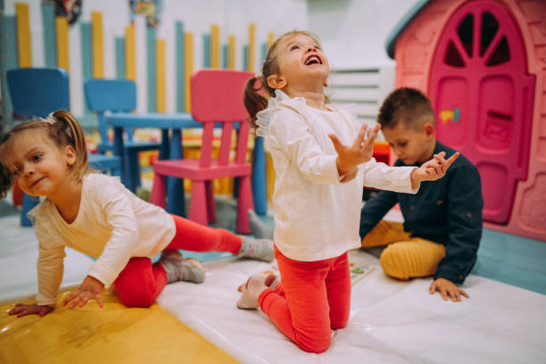 istock Excited kids playing together 1445039635