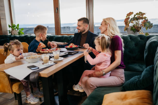 istock Family with three children having fun in a restaurant 1445040338