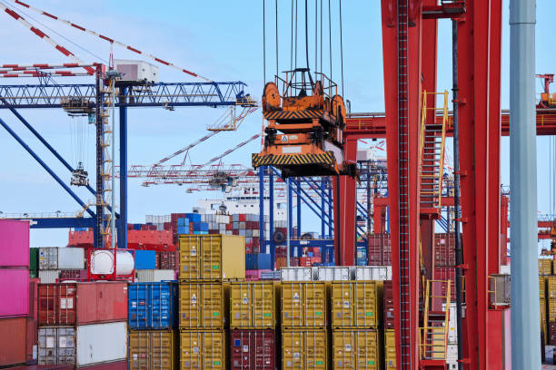 istock Industrial container cargo crane, commercial trade and or international export and import warehouse. Commercial logistics, industry inventory and global supply chain shipping management factory 1445040468