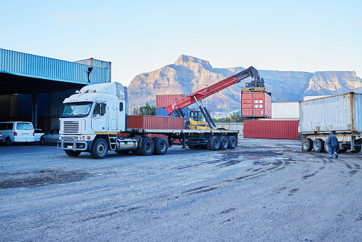 Container, logistics and truck for transport of cargo, stock or manufacturing delivery at a warehouse. Transportation of freight for distribution, shipping and ecommerce at an industrial factory