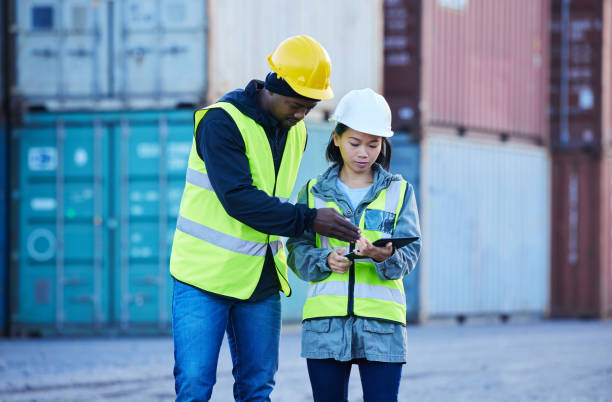 istock People in construction with tablet, supply chain team collaboration and export distribution digital innovation. Industrial freight logistics, port workers in shipping with 5g wifi and cargo container 1445041613