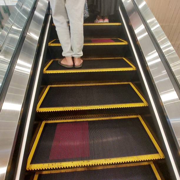istock escalators, electric stairs that make it easier for people to go up or down 1445042522