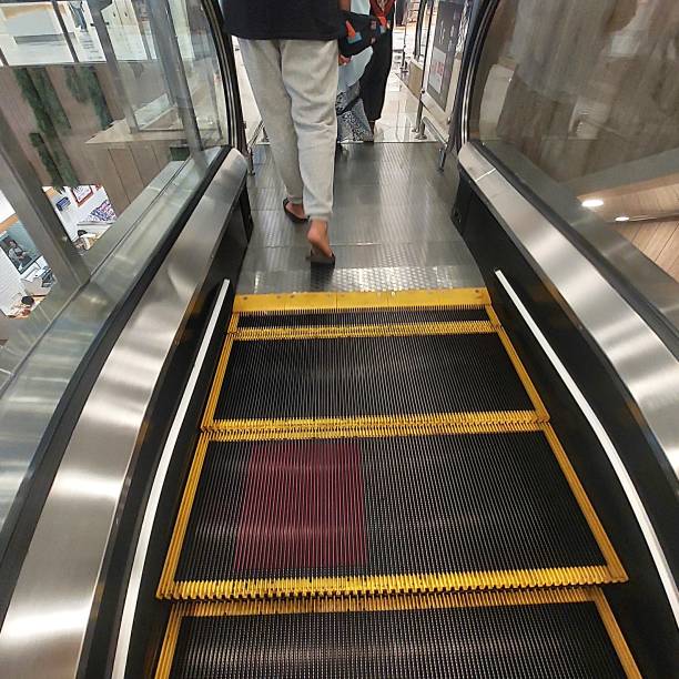 istock escalators, electric stairs that make it easier for people to go up or down 1445042531
