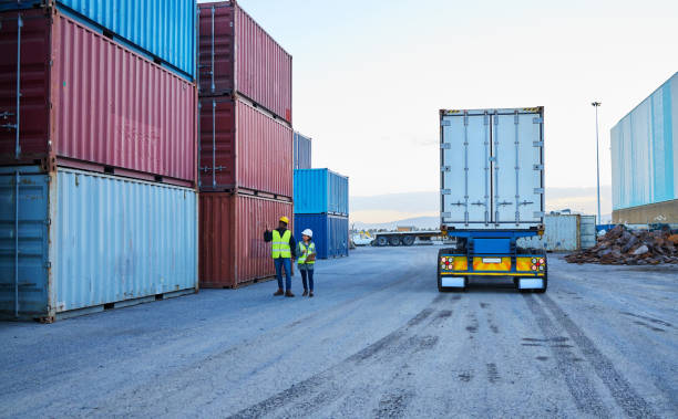 istock Delivery, leadership and logistics manager with worker speaking on shipping cargo, stock or inventory outdoors, Industry employee talking to foreman on truck transportation services in Dallas, USA 1445043368