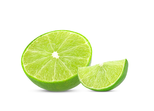 Sliced ginger with lime on white background.