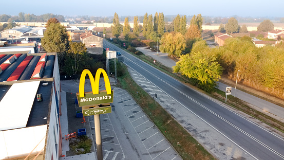 Cremona, Italy - October 2022 Aerial view of Macdonald's restaurant and big sign