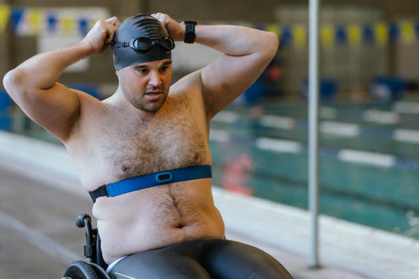 istock Mature Male Adaptive Athlete Training At Pool 1445044839