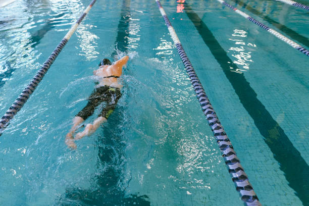 istock Adaptive Athlete Swimming In Community Pool 1445044841
