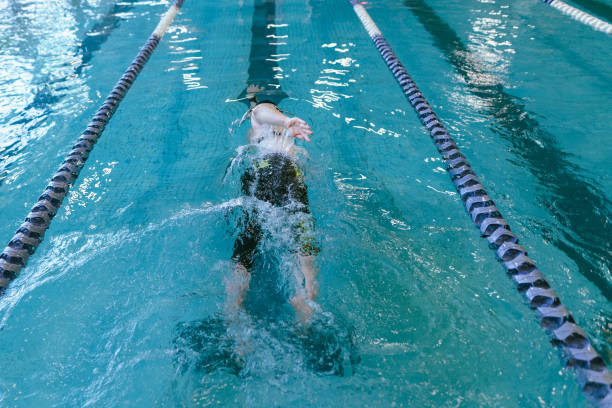 istock Adaptive Athlete Swimming In Community Pool 1445044843