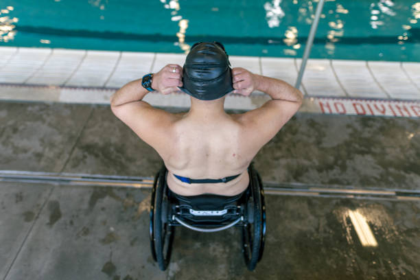 istock Athlete With Disability Preparing To Swim 1445044850