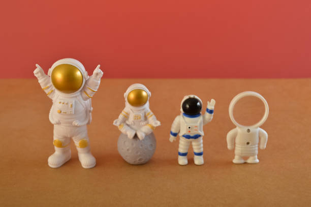 istock Plastic toy figure astronaut in a row. 1445049398