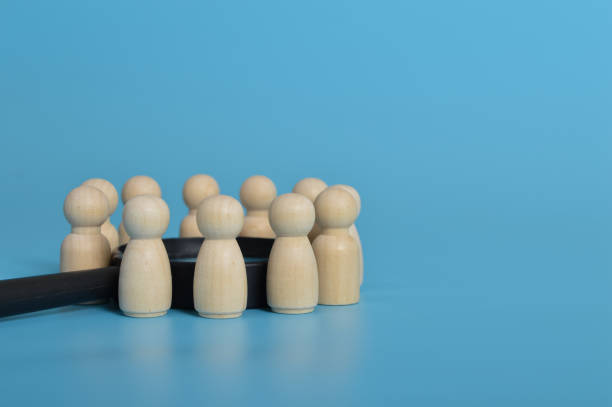 istock Wooden people of figures standing together.discussing, problem solving, meeting corporate success brainstorming teamwork concept 1445049468