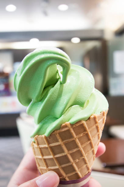 istock Rich green tea soft cream close up in hand 1445055695
