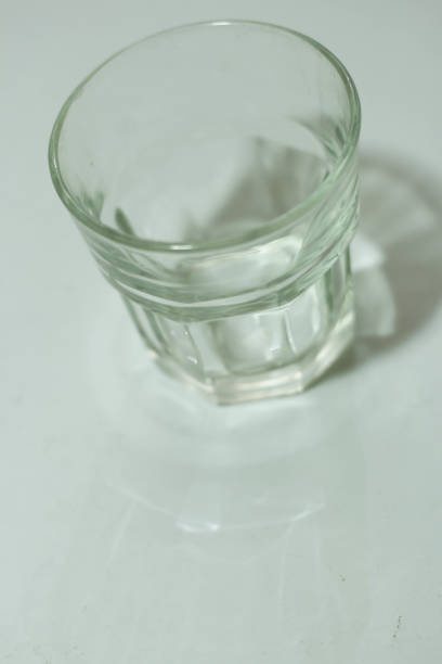 istock Transparent glass on a white background 1445055781