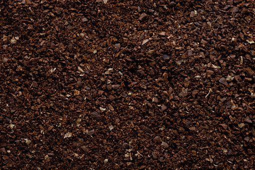 Black granulated coffee texture background