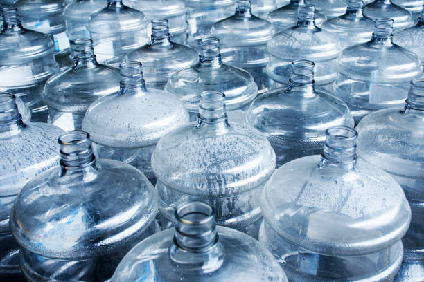 istock Pattern of 19 liter gallon plastic water bottle 1445059176