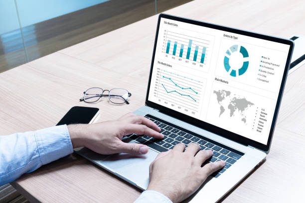 istock Businessman hand on keyboard laptop with mockup chart presentation slide show on display 1445059229