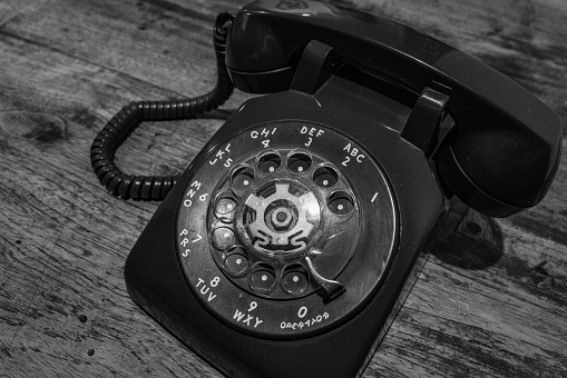 Rotary dial phone, retro-style black and white photo
