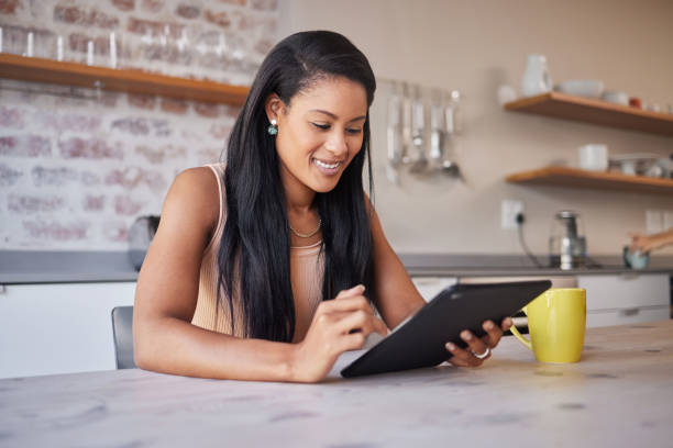 istock Black woman in kitchen, scroll digital tablet for recipe from internet and small business restaurant owner in Brazil. Cafe manager search recipe online, reading email in home and hospitality industry 1445074345